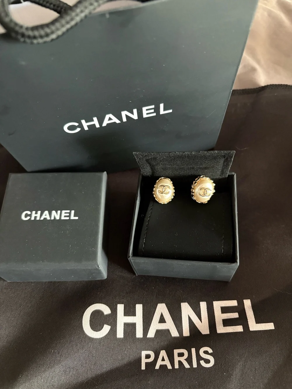 CHANEL Pearl Gold tone  Logo Stud Earrings barely used new condition.